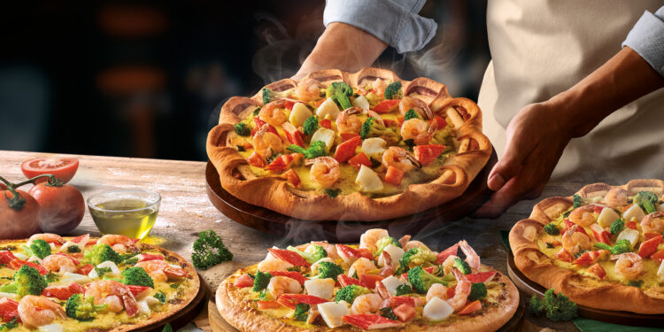 The Pizza Company is known for its Seafood Deluxe Pizza with chunky toppings, premium cheese, and flavors tailored to Vietnamese tastes