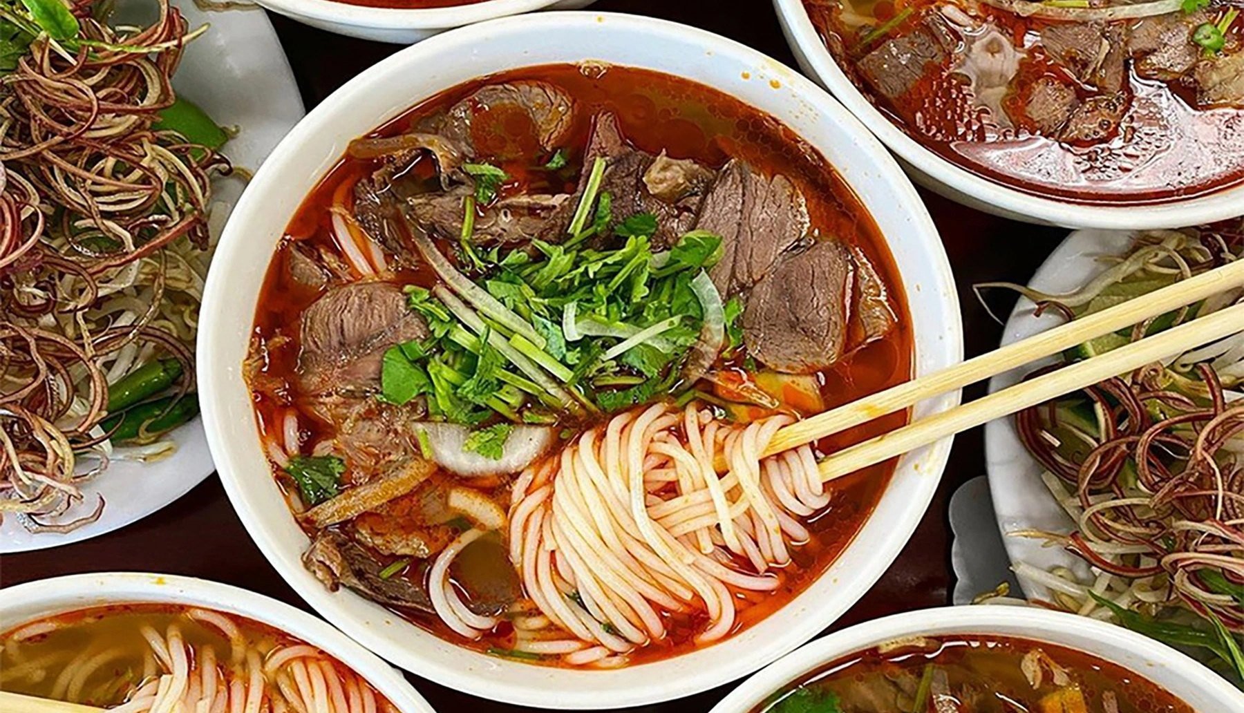 Bun Bo Hue (Hue Beef Noodle Soup) is one of the most famous traditional foods in Hue