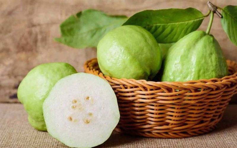 About the size of a softball, guavas are pear-shaped with a bumpy exterior and a light green color.