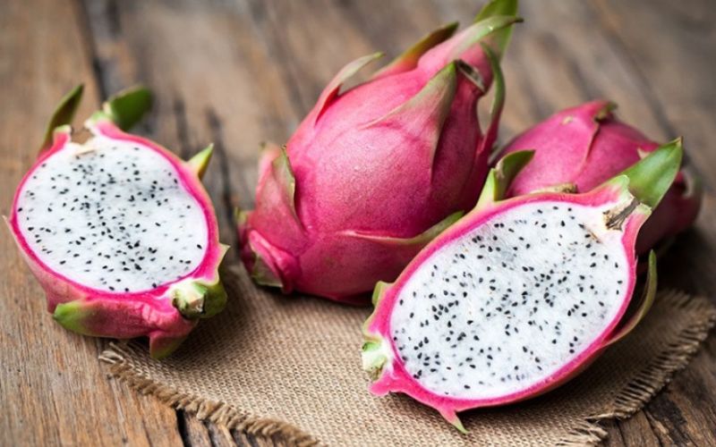 Dragon fruit, grown widely in the Mekong Delta, has a bizarre look with thick fuchsia rind and wispy green extensions outside